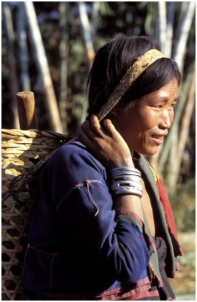 Pao woman in the north Shan state with silver bracelets and belt.